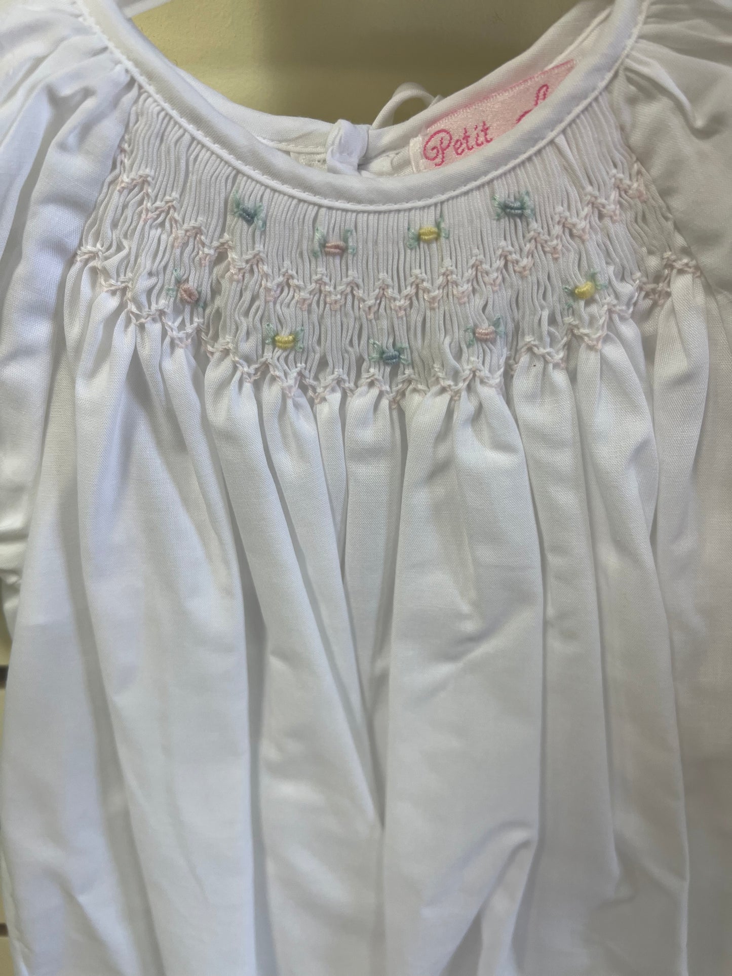 Day gown with raglan sleeves and embroidered hem
