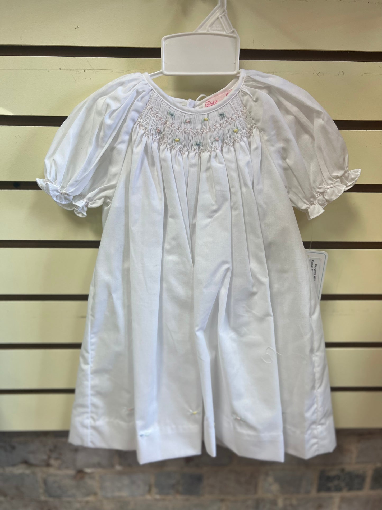 Day gown with raglan sleeves and embroidered hem
