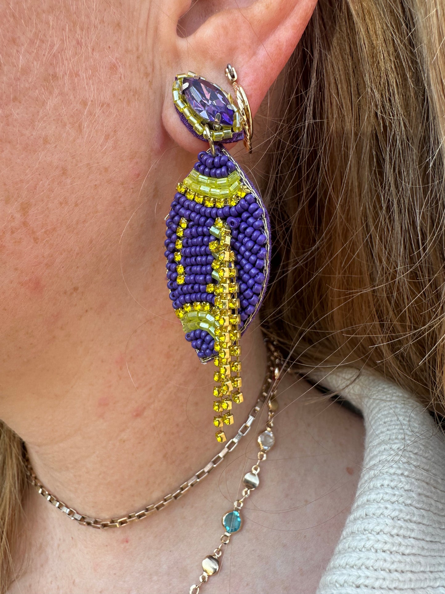 Purple/gold beaded tassel football earrings