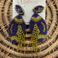 Purple/gold beaded tassel football earrings