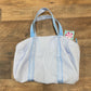 Small light blue duffle